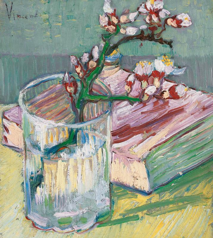 Blossoming Almond Branch in a Glass with a Book